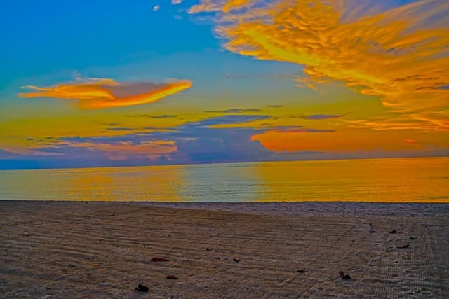 The short walk from the villa gate to Seven Mile Beach sand