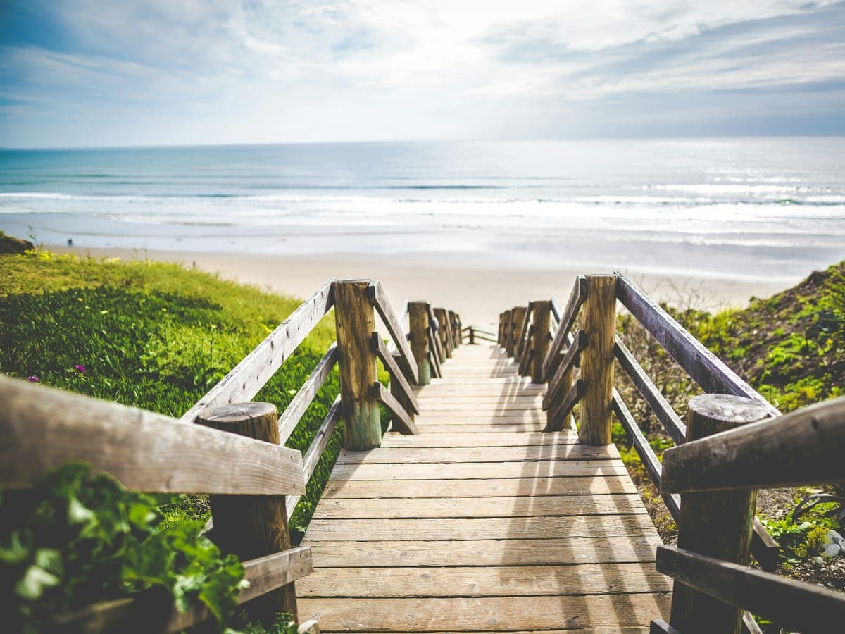 The short walk from the villa gate to Seven Mile Beach sand