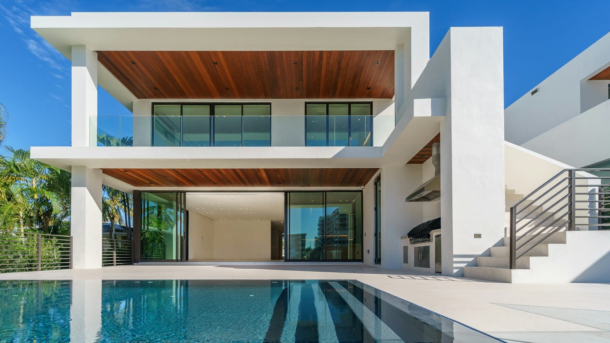 Villa Cocoloco — pool terrace and sea-facing verandas in late-afternoon light